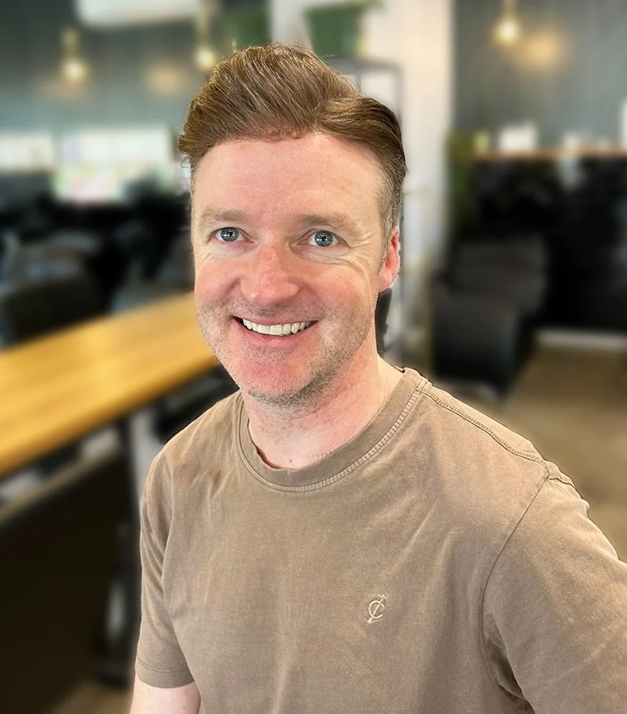 Smiling client in a salon after styling