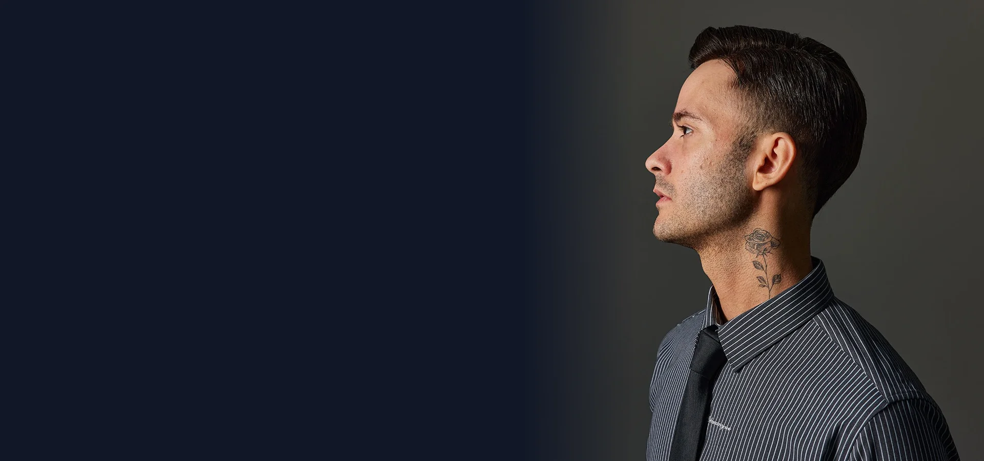 Profile of a man with a slicked-back hairstyleslider_item_3