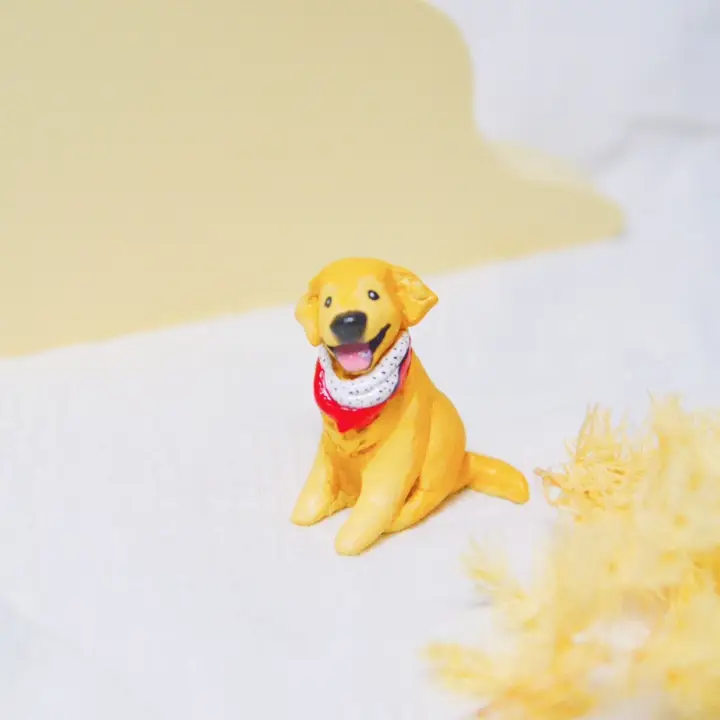 Sitting golden retriever clay figurine