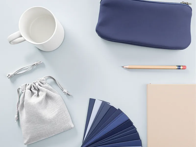 Product samples, fabric swatches and a notebook on a desk