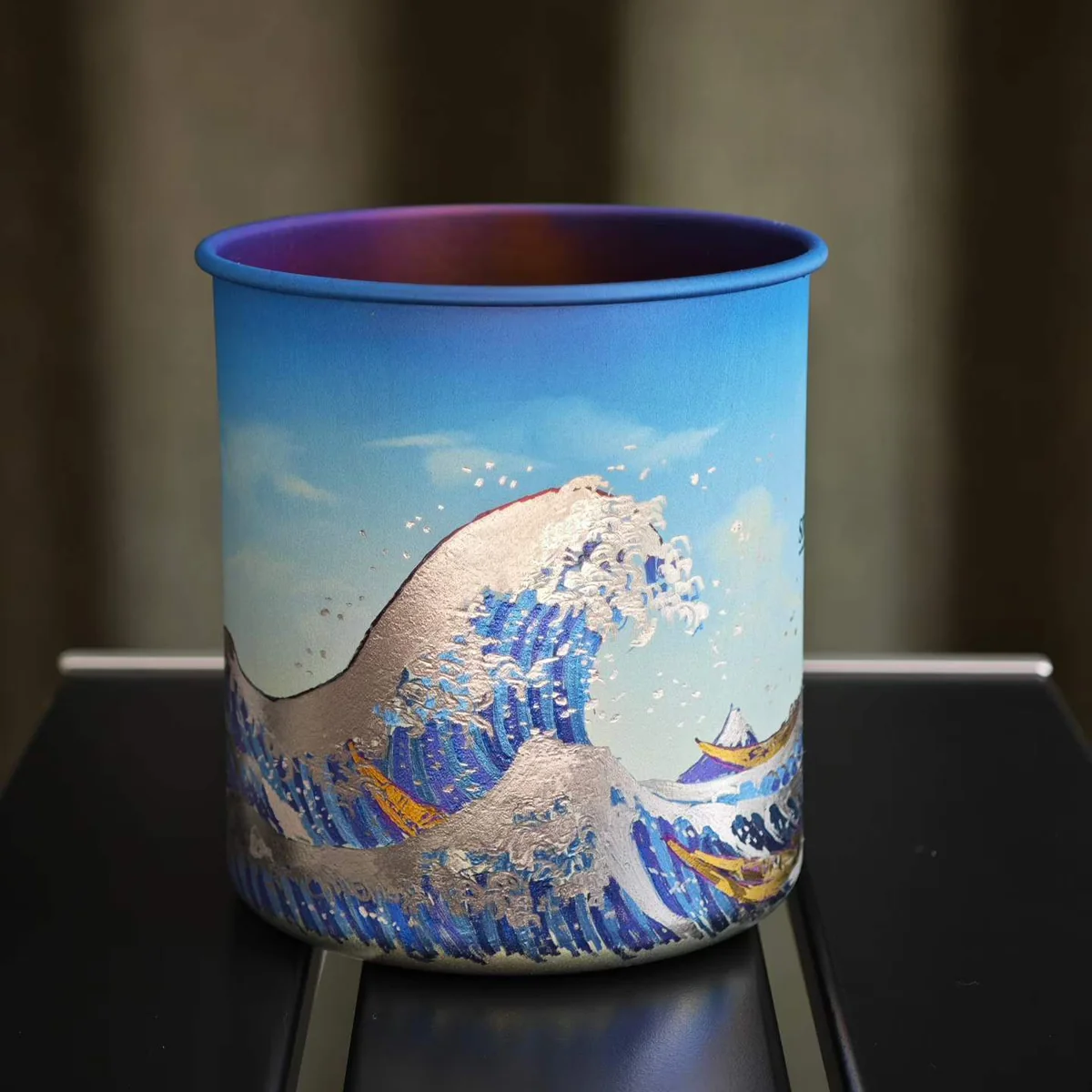 Camp mug painted with a great wave inspired by Hokusai